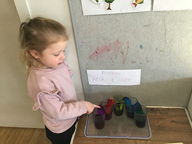 Child exploring science at Busy Bees