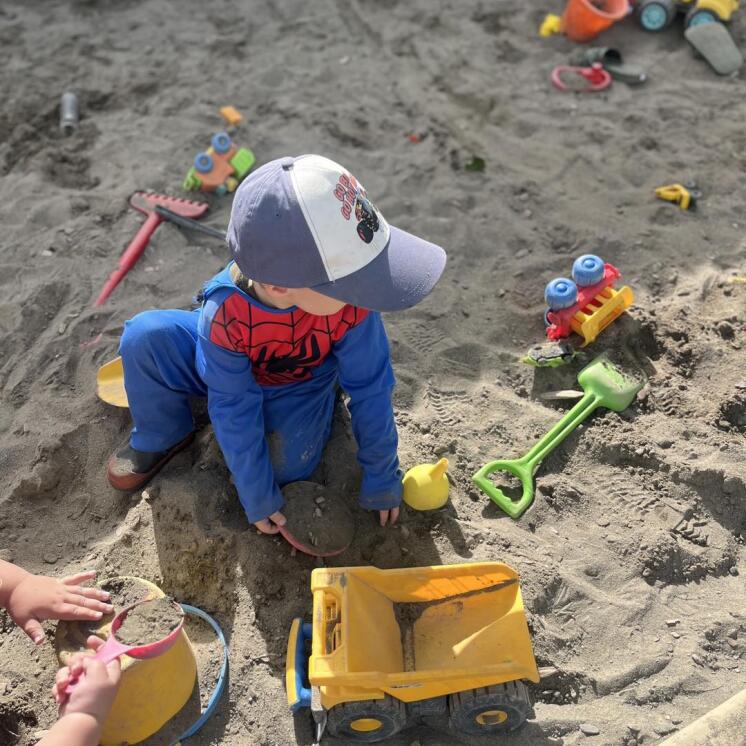 Sandpit play for preschool children enjoying outdoors at Busy Bees Ashburton 