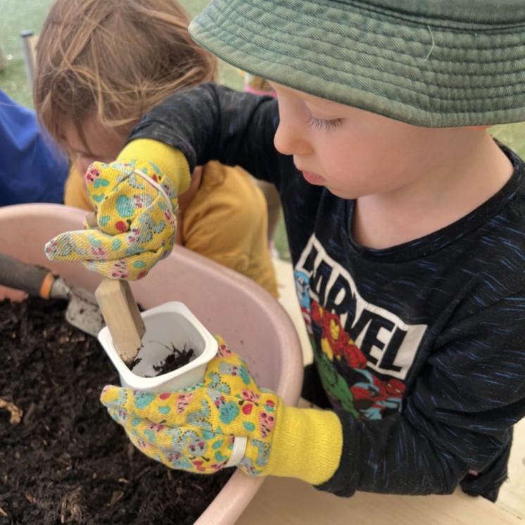 creative Planting plants at Busy Bees Brooklyn