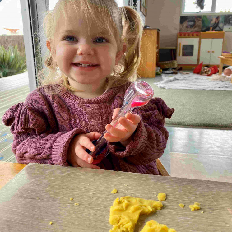 Girl Playing with playdough at Busy Bees Coopers Beach