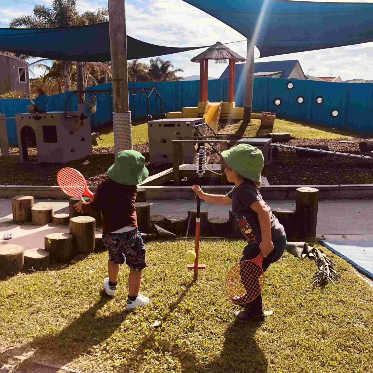 Busy Bees Coopers Beach 2 boys outside playing together 