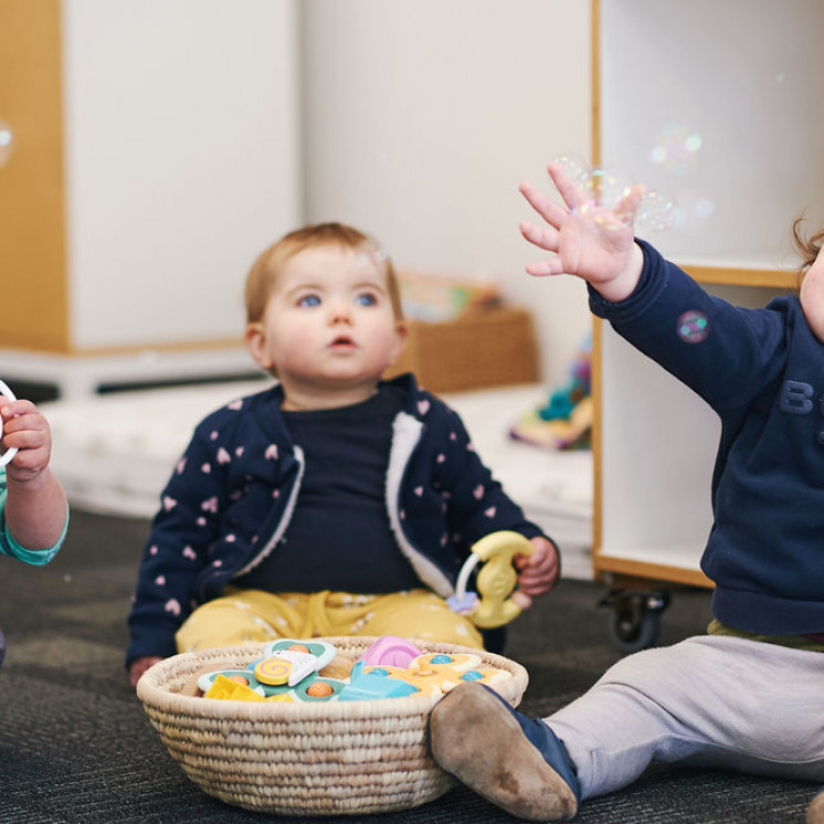 Busy Bees Hobsoville Babys playing indoor with bubbles 