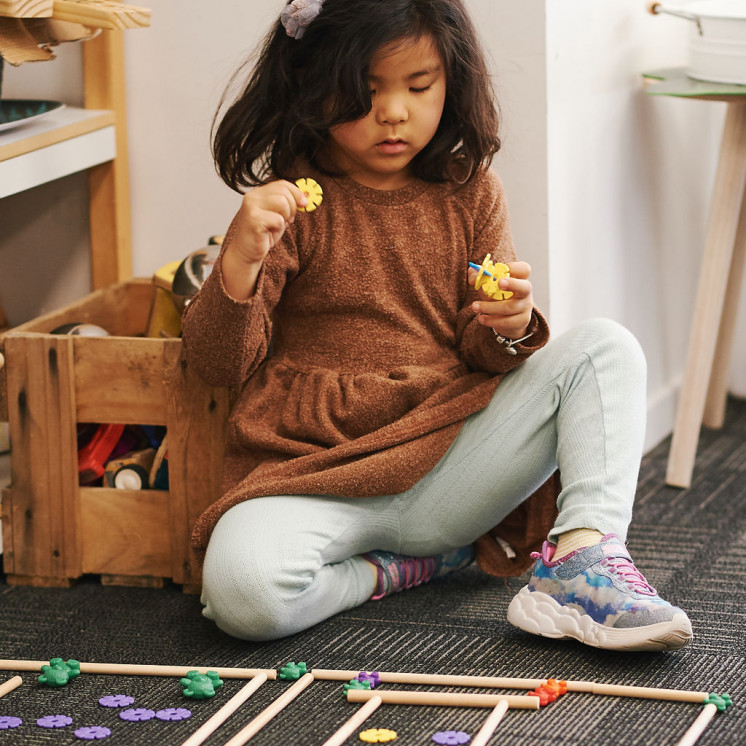 Busy Bees Hobsonville Girl playing with resources 