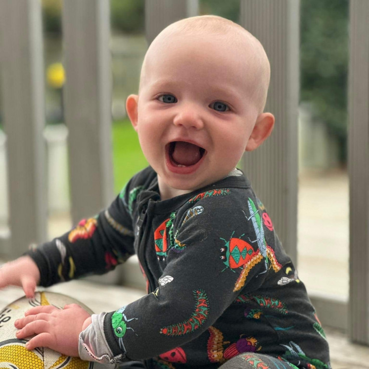 Happy baby smiling at Busy Bees Katikati