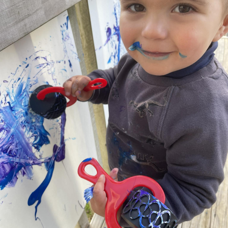 Baby boy - messy play at Busy Bees Kerikeri Nursery 