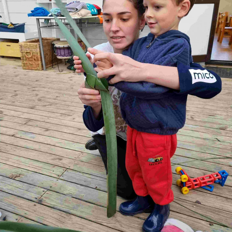 Kaiako and child bonding and building relationships at Busy Bees Kerikeri Preschool