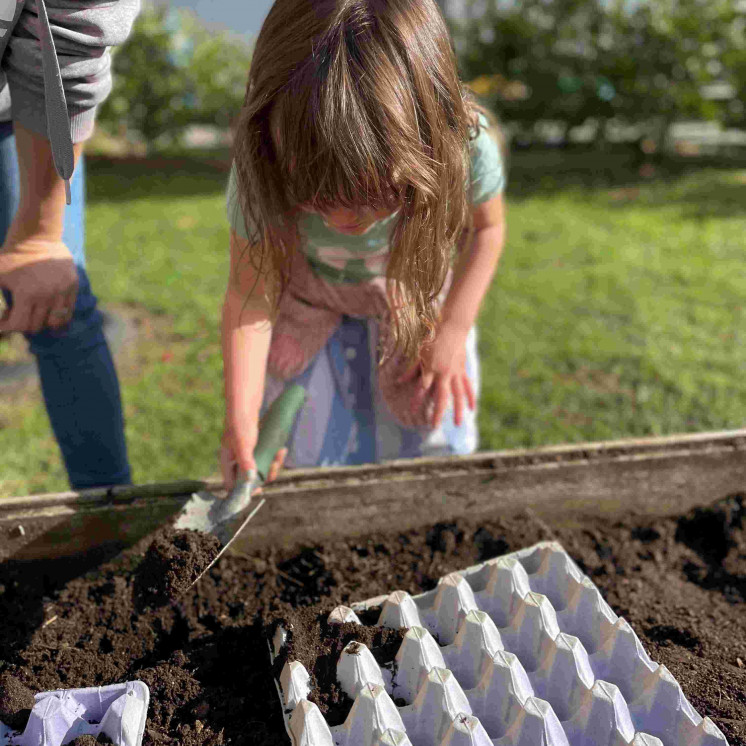 Preschooler gardening at Busy Bees Kerikeri Preschool