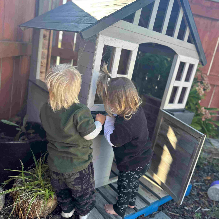 The playhouse is a favorite space for the babies and toddlers at Busy Bees Motueka