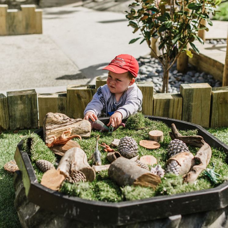 Boy enjoying heuristic resources at Busy Bees Hardy Street