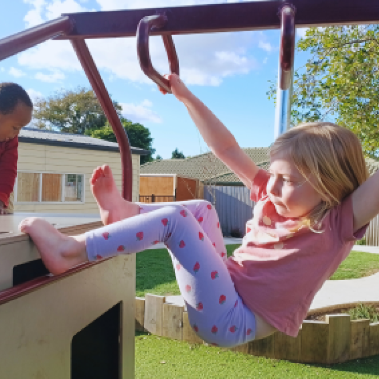 Exploring and playing on the climbing frame.