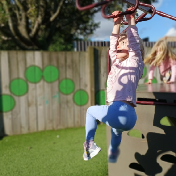 Outdoor play at childcare in Otahuhu for Kindergarten girl