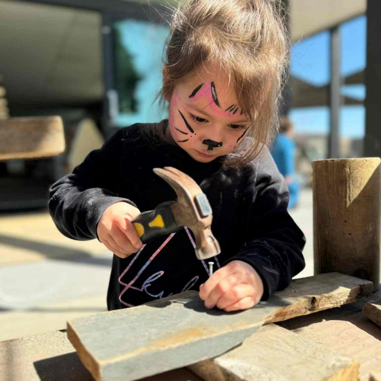 Preschool girl engaged in Building at Busy Bees Taupo