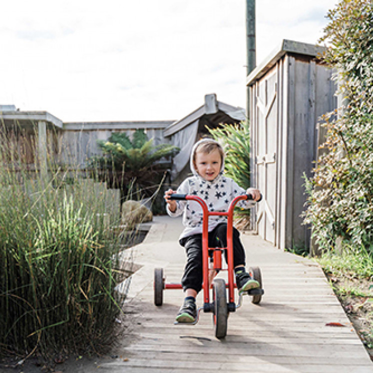 Riding bike outside at Busy Bees Terrace End
