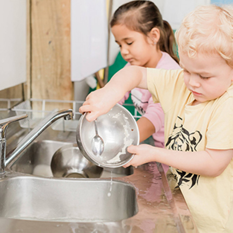 kitchen play and cleaning up at Busy Bees Waitara