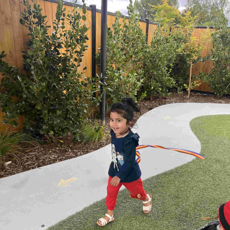 Child playing outdoors at Busy Bees Whakatau Street