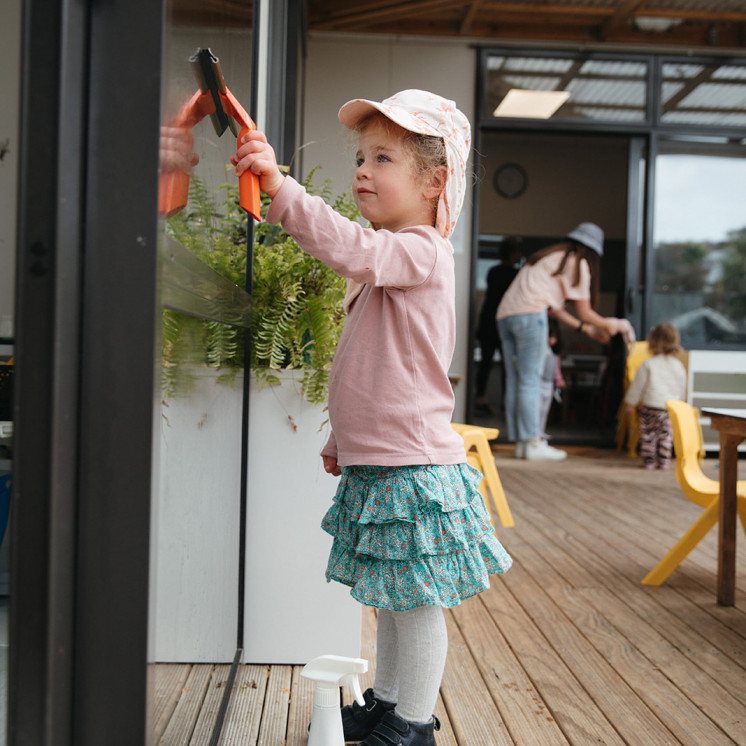 Cleaning outside at Grey Lynn Montessori by Busy Bees